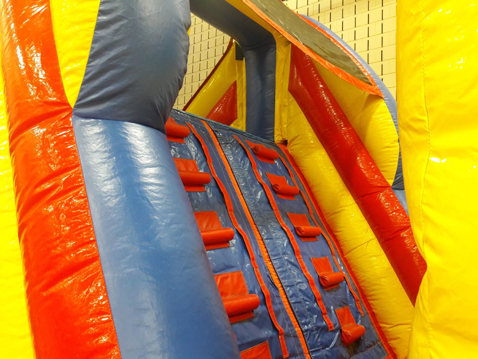 Climbing wall to top of the 13 foot slide on obstacle course